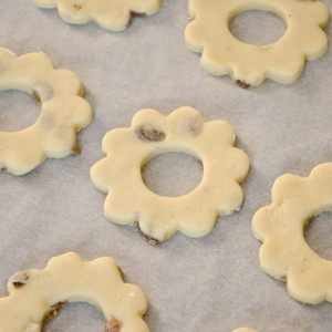 Arrange the biscuits on some baking parchment