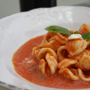 Serve the orecchiette with tomato and ricotta forte