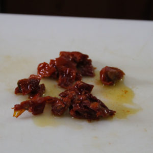 Cut the dried tomatoes